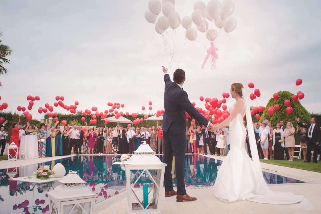 Editorial wedding stage with layered flowers and warm lighting