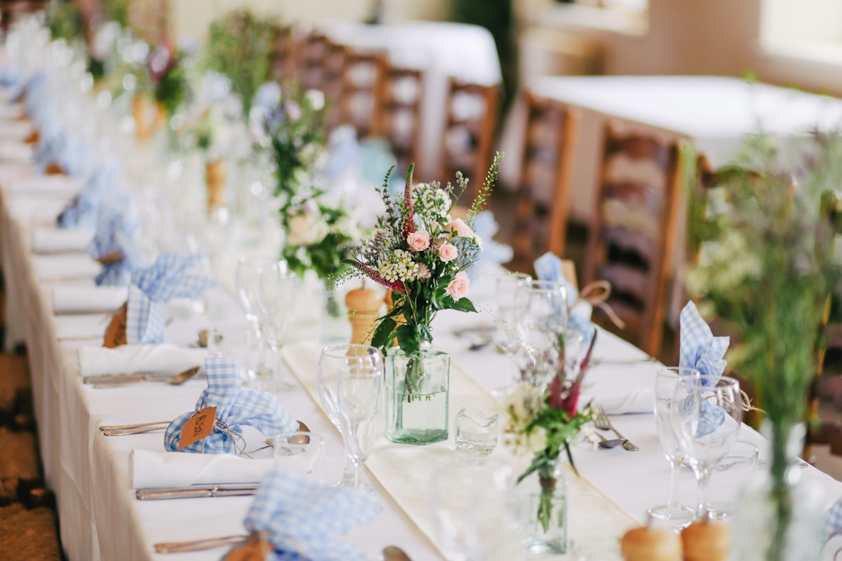 Wedding celebration space with warm lighting and floral installation